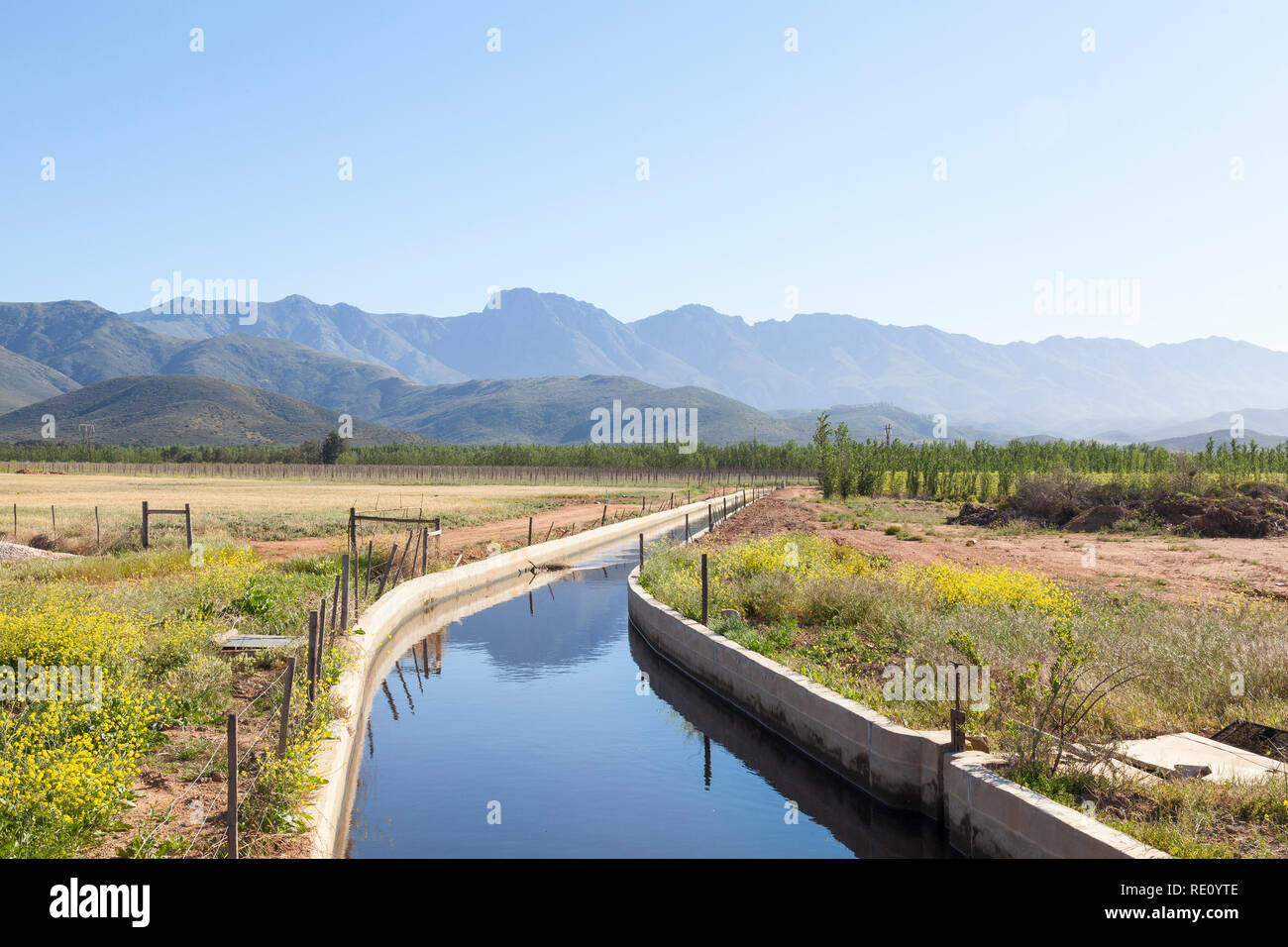 Irrigation canal with water in the winelands of the `Breede River